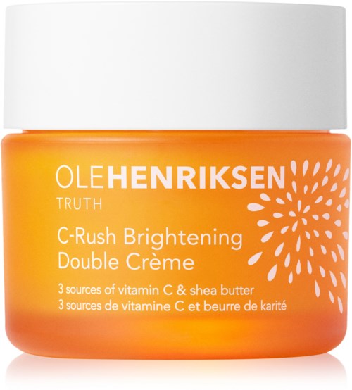 Een potje Ole Henriksen C-Rush Brightening Double Crème met oranje en witte verpakking, met vitamine C en sheaboter.