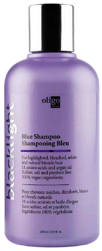 Lila fles met Blacklist Blue Shampoo en zwart deksel. Bevat natuurlijke ingrediënten, veganistisch, voor blond, gebleekt en wit haar.