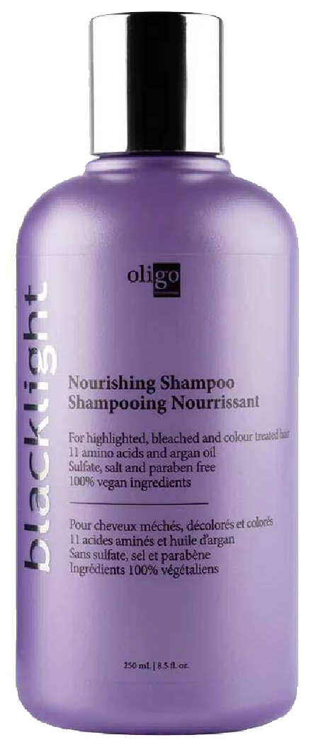 Paars shampoofles met zwarte dop, gelabeld 'Blacklist Nourishing Shampoo' voor highlights en kleuring.