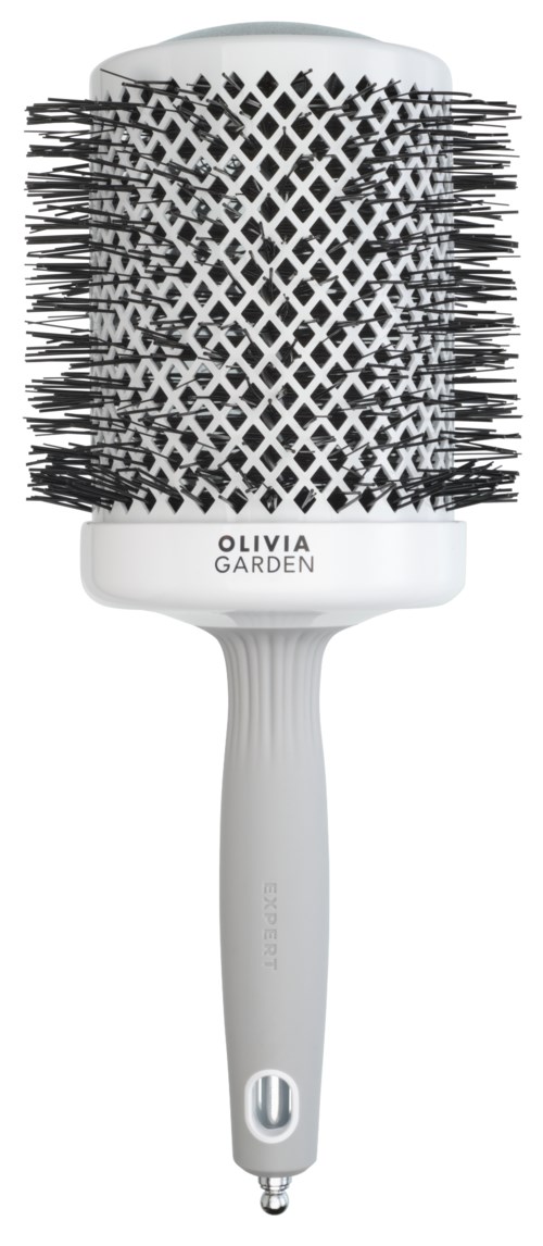 A white hairbrush with black bristles, labeled 'OLIVIA GARDEN,' has a long handle and a rounded top.