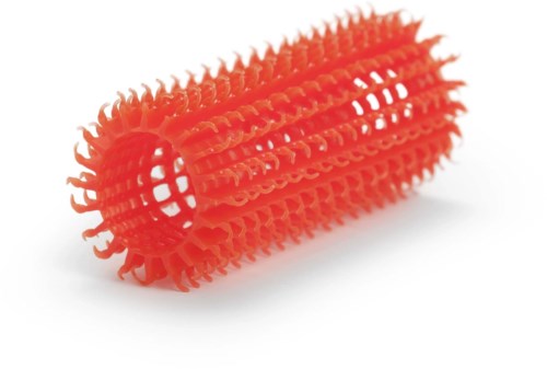 A red plastic roller with many small spikes, likely used for massage or cleaning. It is cylindrical and hollow in the middle.
