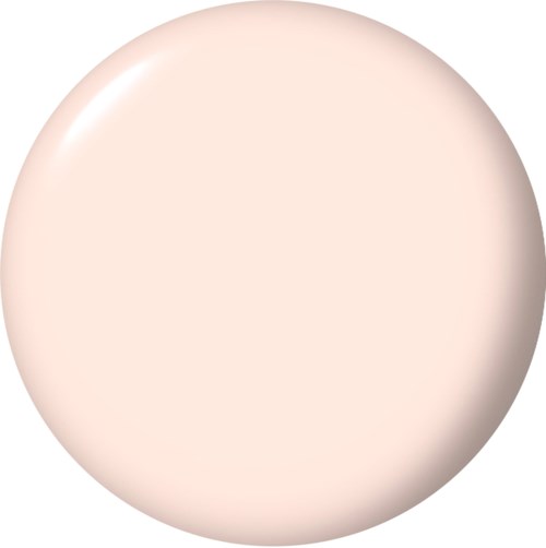 En rund, myk beige makeup-svamp med glatt overflate.