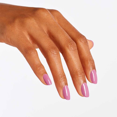 A hand with neatly painted pink nails is shown against a white background.