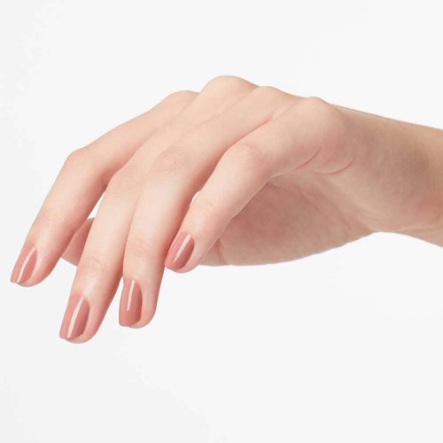 Hand with neatly painted nails, fingers slightly curved, light skin tone, plain background.