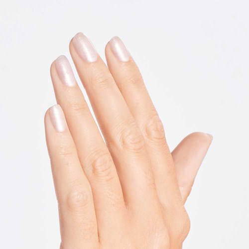 A hand with neatly painted, shiny light-colored nails against a plain background.