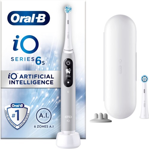 A white electric toothbrush with a blue and white box, and several accessories and charging station nearby.