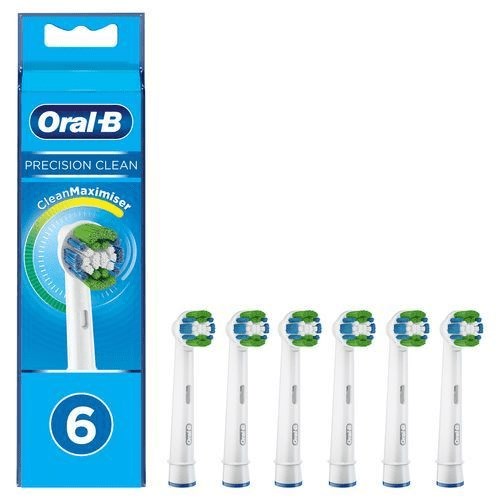 Six Oral-B replacement toothbrush heads in a box, mainly white with green and blue accents.