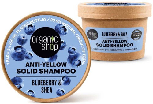 En rund sjamposlapp og en beholder som viser blåbær og shea-ingredienser for anti-gulning fast sjampo.