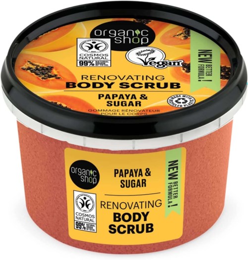A round container of body scrub with orange and black label, featuring papaya and sugar ingredients.