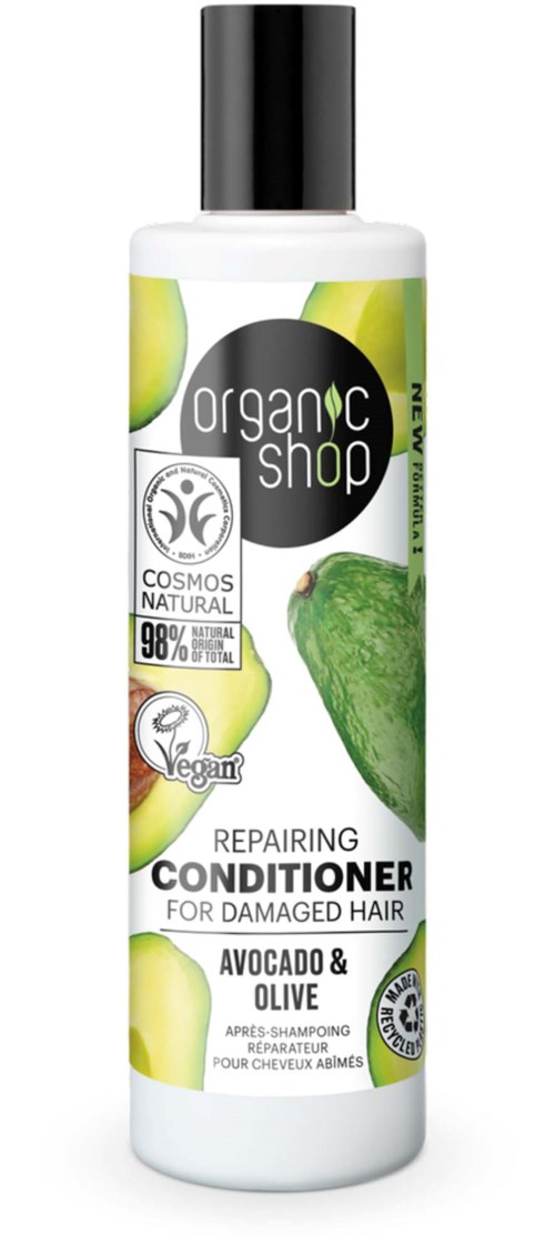 A white bottle with a black cap, green avocado, and olive images, labeled for repairing damaged hair with vegan and natural ingredients.