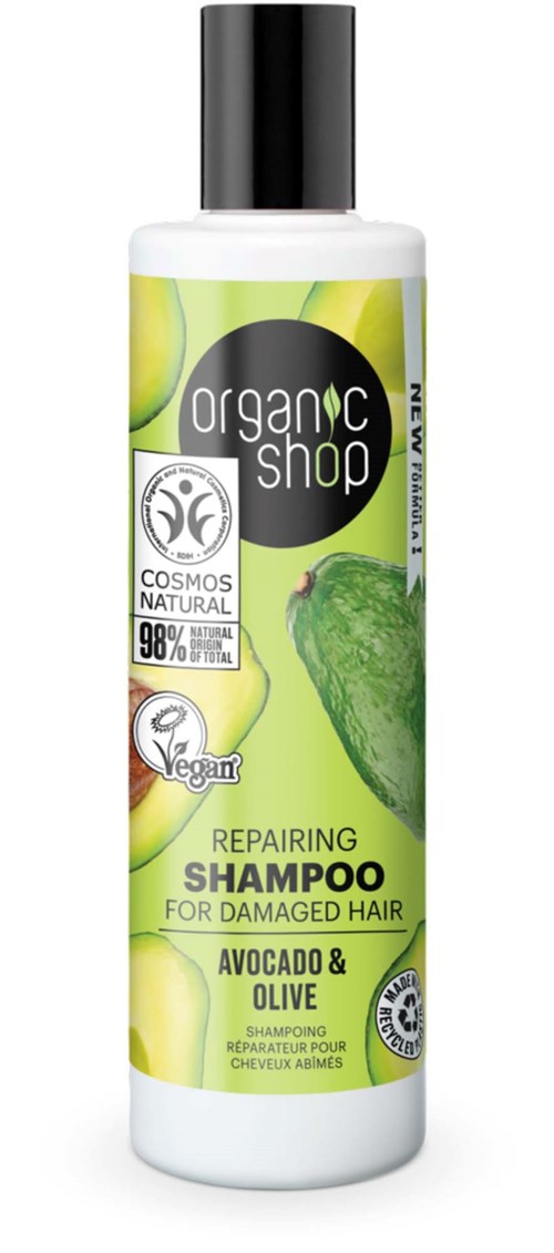 A white bottle of organic repair shampoo with avocado and olive, designed for damaged hair, featuring green and black labels.