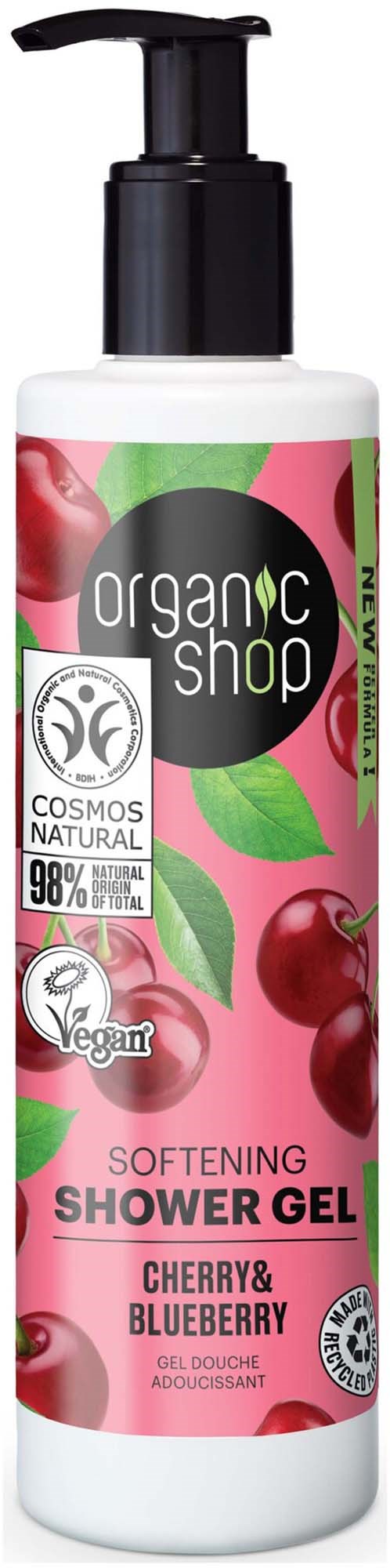 A bottle of cherry and blueberry softening shower gel with a pump, featuring eco-friendly and vegan labels.
