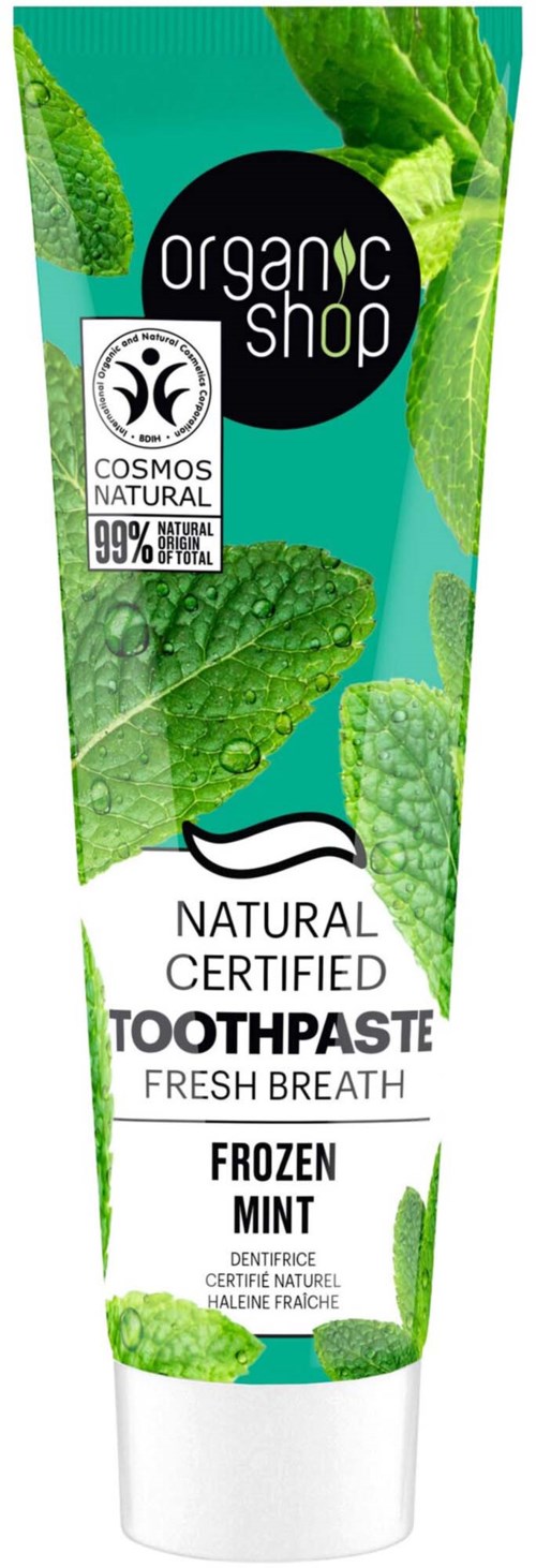 A tube of organic toothpaste with mint flavor, green leaves design, and certification labels, emphasizing natural ingredients.