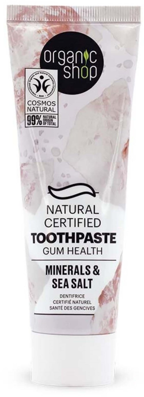 A tube of organic toothpaste labeled for dental health with sea salt and minerals, certified natural, 99% natural ingredients.