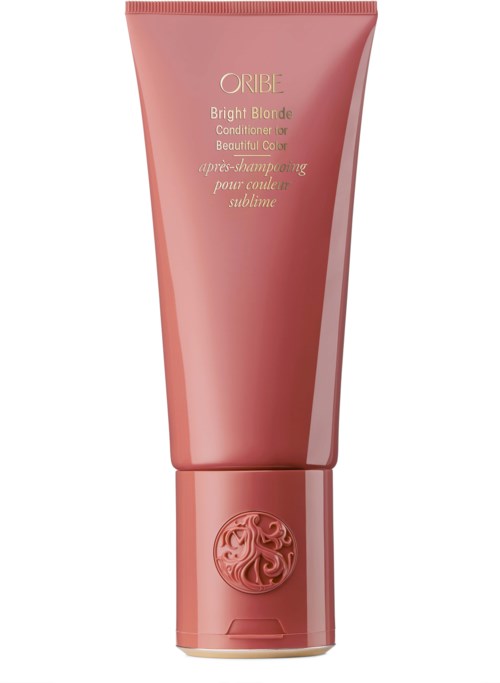 Eine rosa Tube Oribe Bright Blonde Conditioner mit dekorativem Deckel und goldener Beschriftung.
