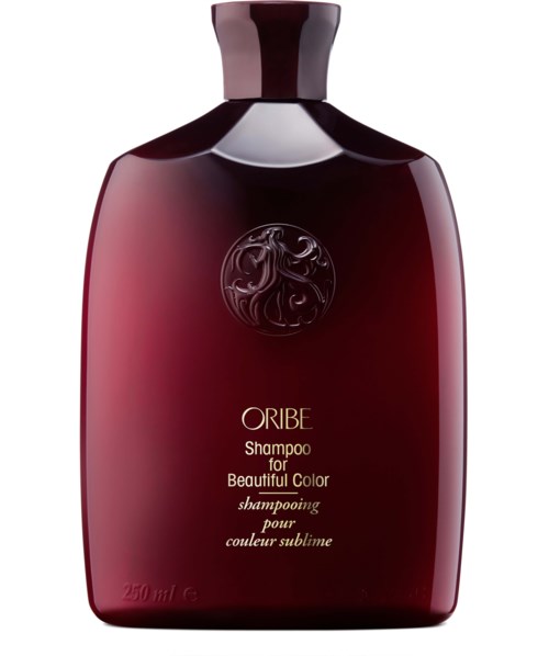 Dunkelrote Shampoo-Flasche mit schwarzem Deckel, beschriftet Oribe, für schöne Farbe.