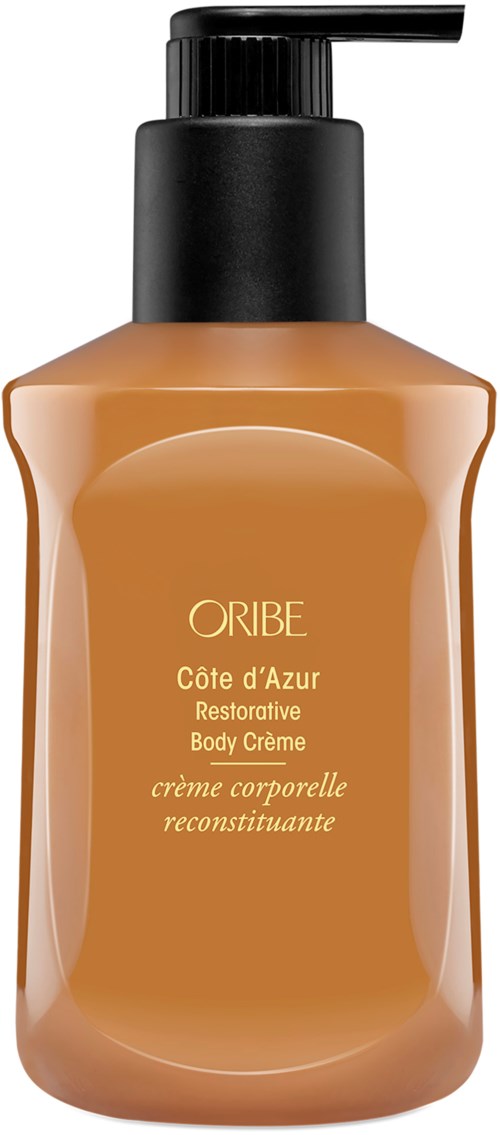 Eine Sonnencremeflasche mit schwarzen Pumpe, gekennzeichnet 'ORIBE Côte d'Azur Restorative Body Crème', in hellbraun.