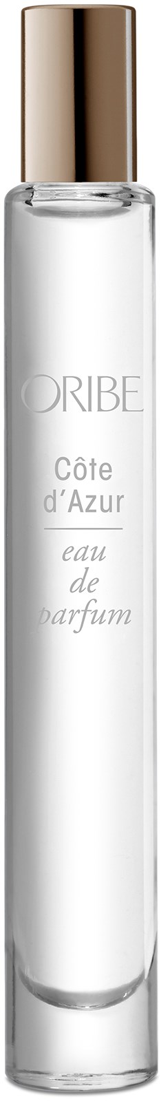 A tall, clear perfume bottle with a gold cap, labeled "ORIBE Côte d'Azur eau de parfum."