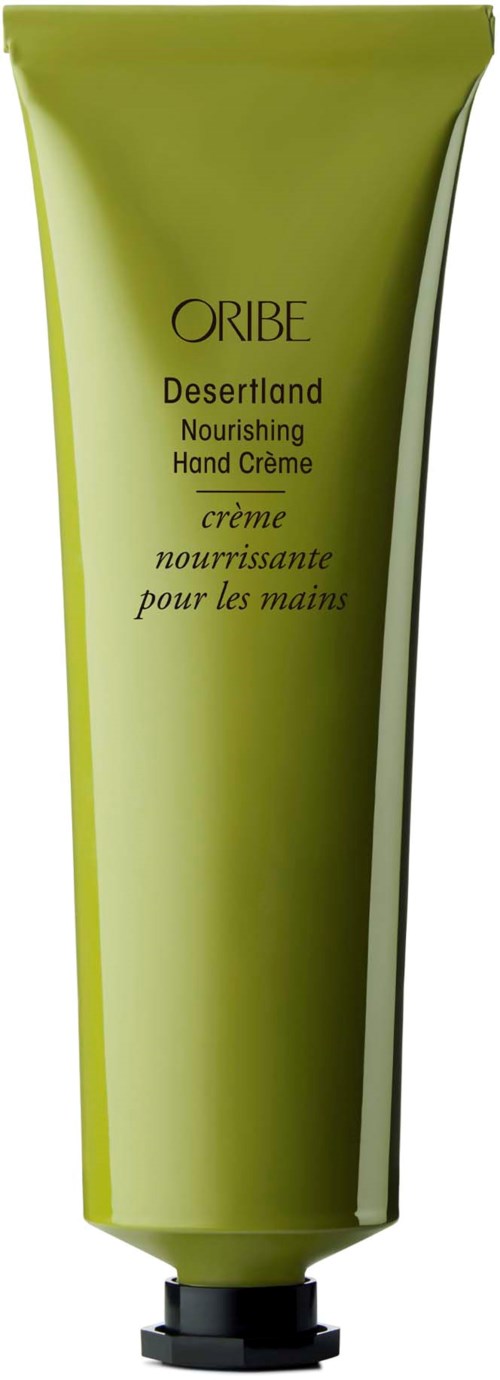 Grüne Tube mit Oribe Desertland Nourishing Hand Creme und schwarzem Deckel.
