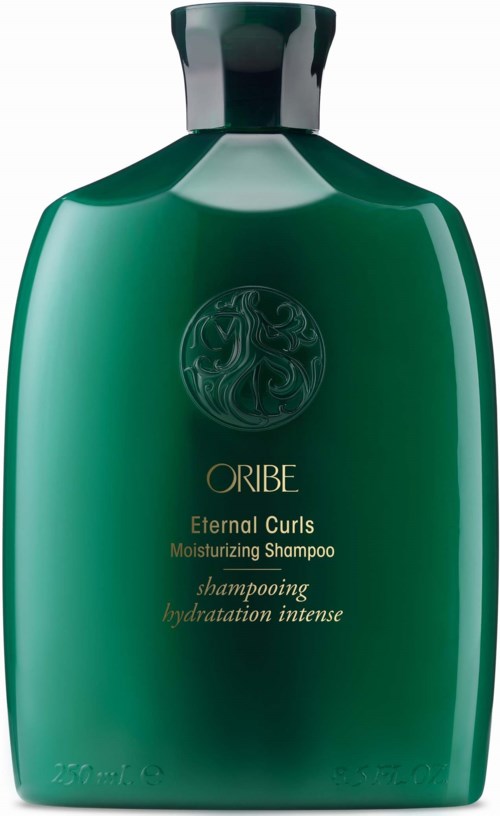 Vihreä shampoonipullo, jonka kyljessä kullanvärinen ja musta teksti, etiketti Oribe Eternal Curls Moisturizing Shampoo.