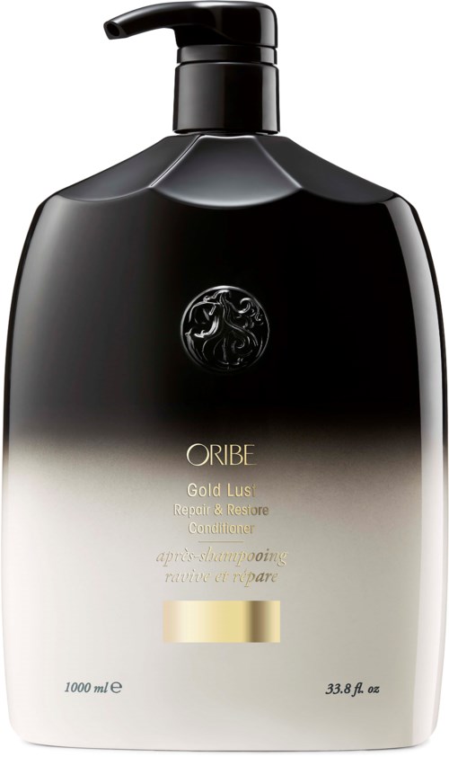 Eine schwarze und goldene Shampooflasche mit Pumpe, beschriftet "ORIBE Gold Lust Repair & Restore".