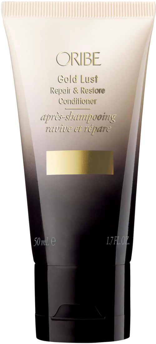 Eine Tube mit der Aufschrift 'Oribe Gold Lust Repair & Restore Conditioner' mit einem goldenen Streifen, schwarz-weiße Farben.