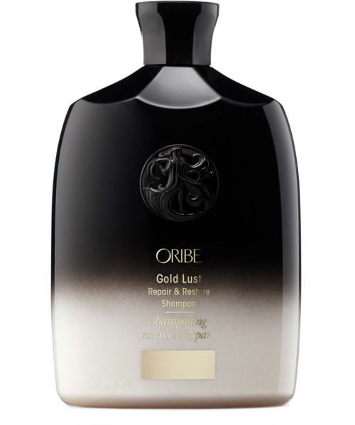 Ein schwarzer und weißer Gradient-Shampoo-Flasche mit runder Kappe und goldener sowie schwarzer Schrift. Es heißt Oribe Gold Lust.