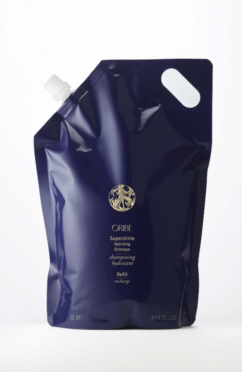 Dunkelblaue Nachfüllpackung für Oribe Supershine Hydrating Shampoo mit weißer Kappe und kleinem Griffloch.