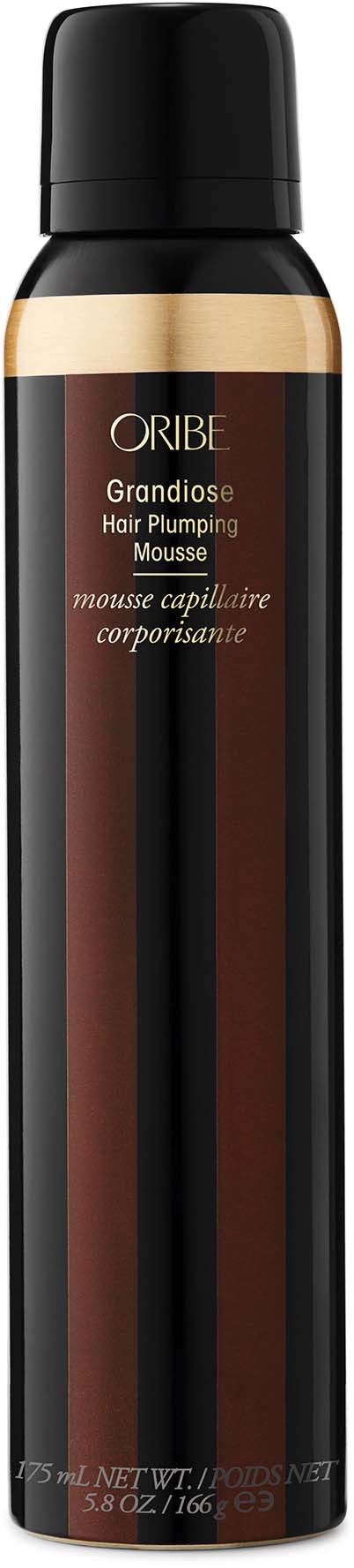 Eine schwarze Dose mit goldenen und braunen Akzenten, beschriftet als Oribe Grandiose Hair Plumping Mousse.