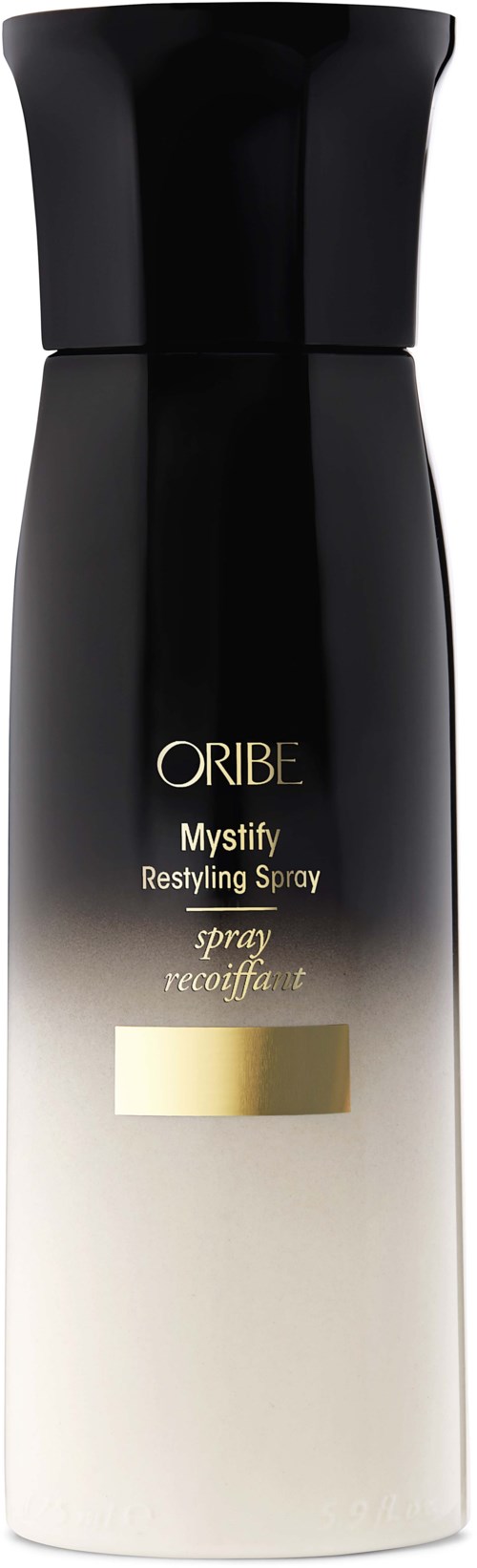 Schwarze und weiße Flasche mit Oribe Mystify Restyling Spray mit Goldakzenten.