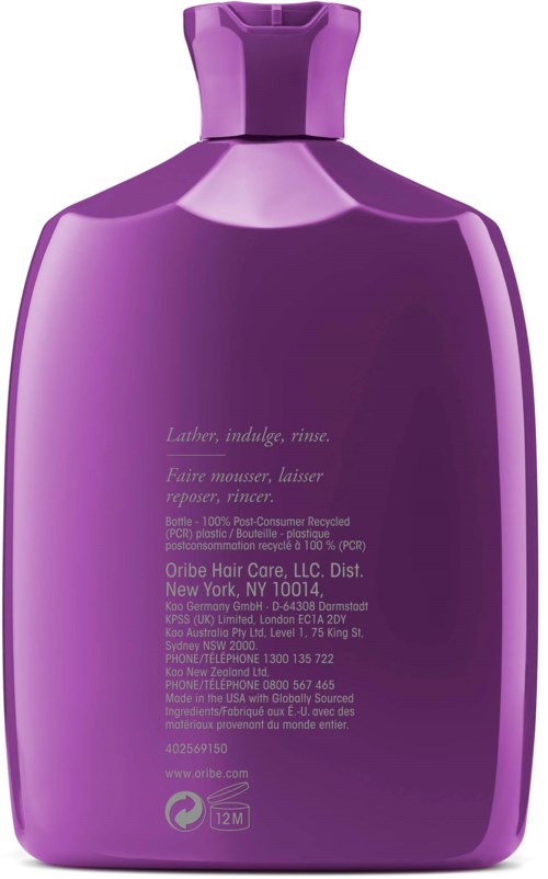Eine lilafarbene Flasche mit Haarpflegeprodukt und Text auf der Rückseite, inklusive Inhaltsstoffe und Anweisungen.