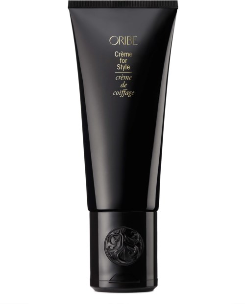 Eine schwarze Tube mit Oribe-Hairstyling-Creme mit goldener und schwarzer Schrift und einem dekorativen Logo am unteren Ende.