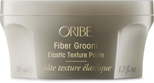 Ein beigenes Gefäß mit goldener Schrift, zeigt es ist für Faserpflege und Strukturcreme.