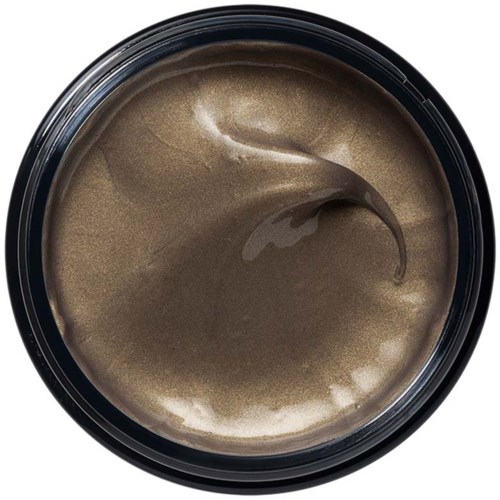 Ein Behälter mit braun-goldener Creme oder Paste darin, glatte und glänzende Oberfläche, wahrscheinlich Kosmetik- oder Lebensmittelprodukt.