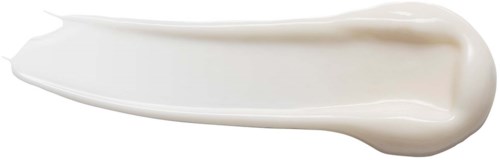 Weiße Creme auf einem Löffel, glatt und glänzend.