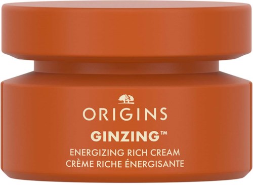 Ein kleiner oranger Behälter mit der Aufschrift Origins GINZING, als belebende reiche Creme beschrieben.