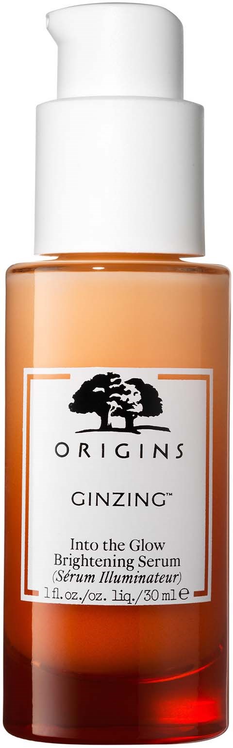 En liten flaska med vit pump innehållande ljusnande serum från Origins, märkt 'Ginzng', inuti flaskan är orange.