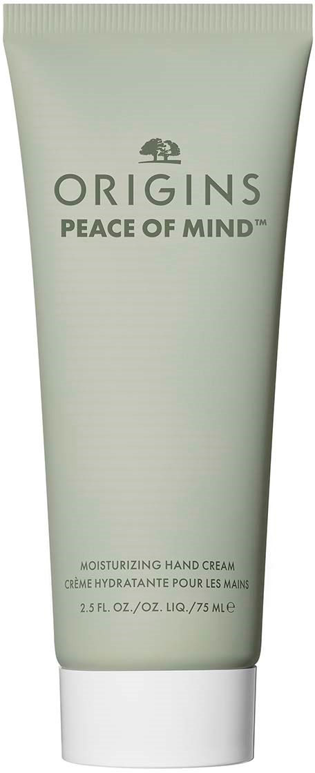 En tub med Origins Peace of Mind handkräm med enkel, ljusgrön design och svart text.
