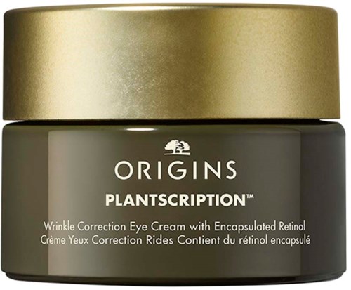 Ein kleiner Behälter mit goldener Deckel und grauem Körper, beschriftet ORIGINS PLANTSCRIPTION, für Augencreme mit Retinol.
