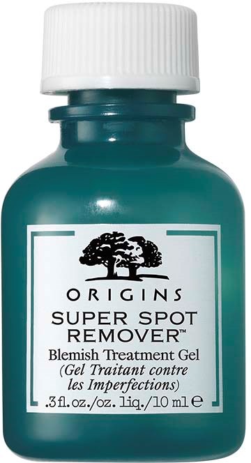 A small teal bottle labeled 'Origins Super Spot Remover' with a white cap, used for treating acne spots.