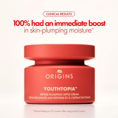 Red jar with white and red text promoting skincare cream, emphasizing immediate skin plumping results.