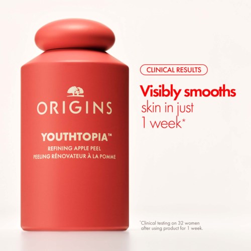 A pink bottle of Origins Youthtopia apple peel with text about skin smoothing in one week.