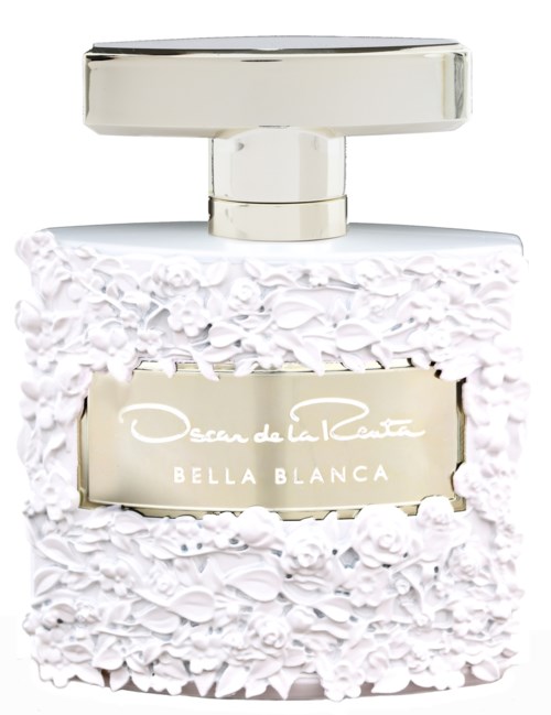 En parfymflaska med vit, texturerad design och ett silverlock, märkt "Oscar de la Renta Bella Blanca."