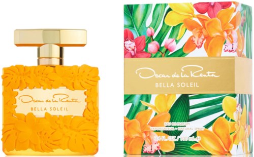En parfyllflaska med gula blommor och en färgstark blomburk, båda märkta 'Bella Soleil' av Oscar de la Renta.