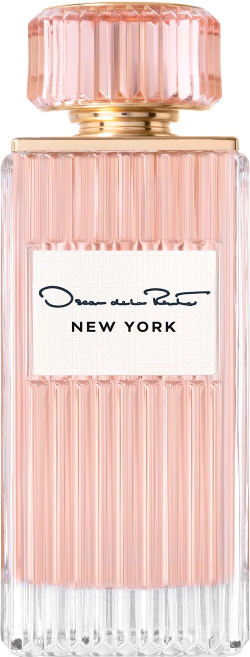En lång rosa parfymflaska med gulddetaljer och en vit etikett som står 'NEW YORK' och en signatur.