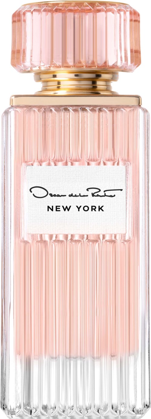 En rosa parfymflaska av glas med räfflad design och en stor rosa kork, märkt 'New York'.