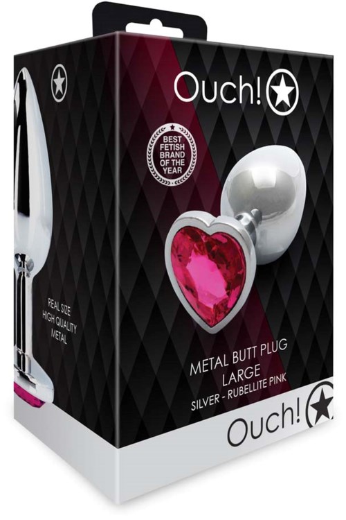 Verpackung eines Erwachsenen-Spielzeugs mit einem glänzenden Metall-„Butt Plug“ und einem pinken Herz mit Edelstein. Beschriftet mit 'Ouch!' und 'Large'.