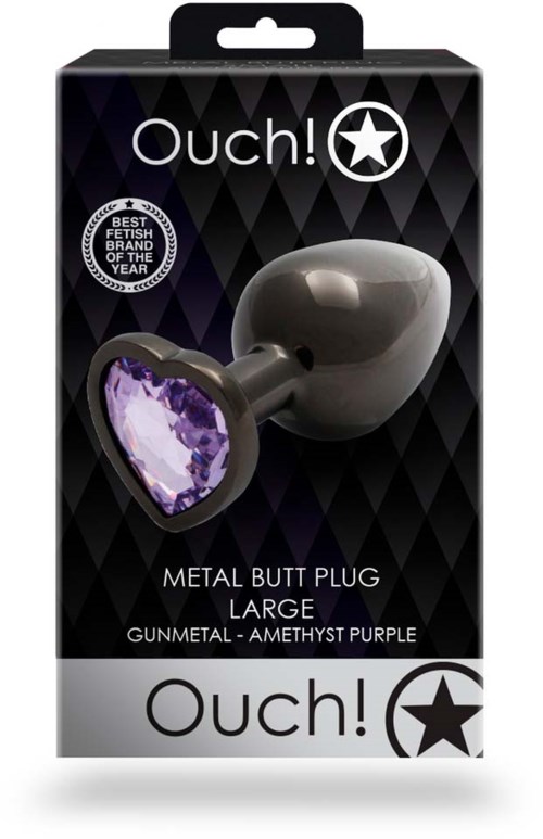 Ein Metall-Butt Plug mit einem lila Herz. Schwarze Verpackung mit Marken- und Preisschild, steht für große Größe.