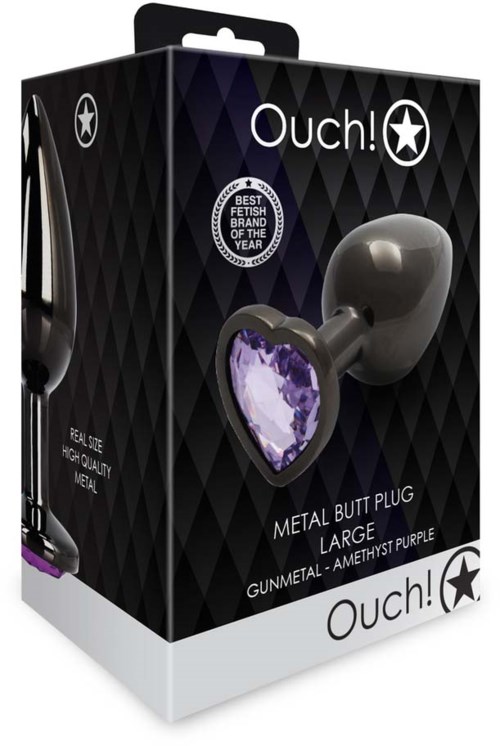 Eine schwarze Verpackung mit einem großen, silbernen Metall-Butt-Plug mit lila Edelstein.