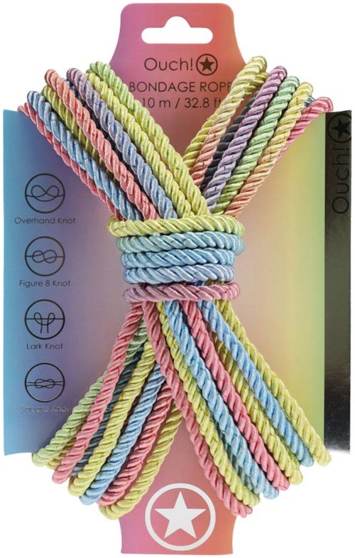 Bunte gedrehte Seile in rosa, blau, gelb, lila und grün, an einem Karton mit Anweisungen und einem Stern befestigt.